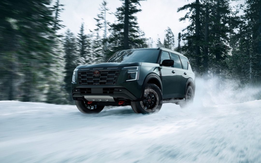 Nissan Armada driving through snow for winter maintenance and cold weather service near Stone Mountain, GA